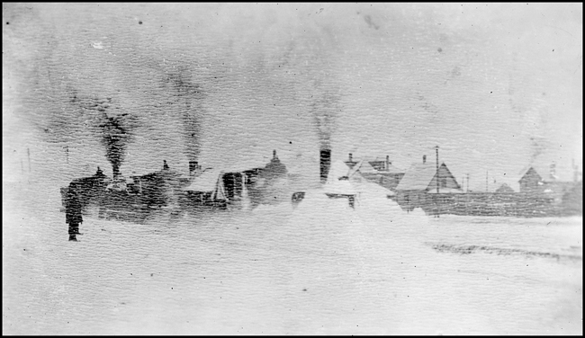 Montana RR  Three engines in snowdrift  Lewistown Mont 1903  Copy negative from LeFever  The Montana RR was initially under NP control, leaving the NP at Lombard and making its way up 16 mile creek canyon  It eventually became part of the MILW  main line  It was nicknamed 