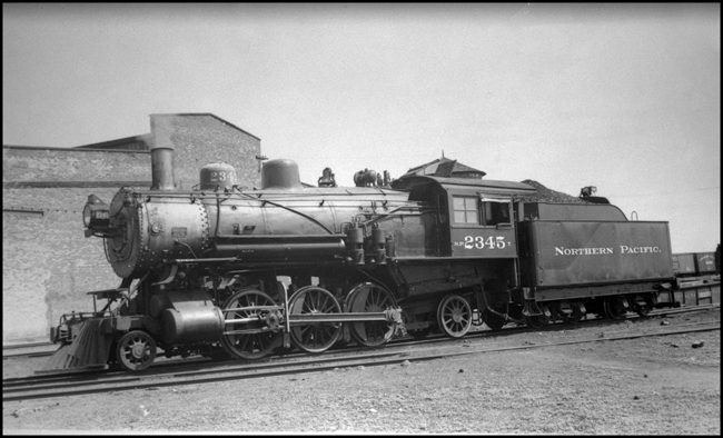 NP 2345  Dilworth  5-27-40  This is a class T 2-6-2 built by Alco at their Brooks works in 1907  NP had 150 of these locomotives, but they were never quite satisfactory in their performance  They did OK on flat branch lines, but lacked the power for mountain grades  Many were relegated to switching duty  Six were rebuilt into class W-4 2-8-2s  Eighteen were superheated and otherwise rebuilt into class T-1  Note the consecutive numbers on 2345  Warren R McGee photo