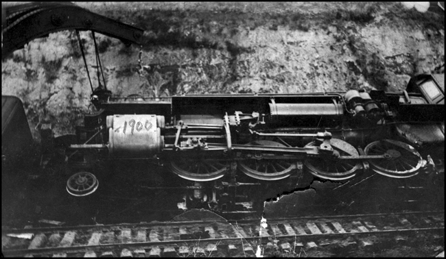 NP 1900 wrecked near High Bridge ND  5-9-16  Engineer Seaburg was on the 1900, the second engine behind 1904  Seaburg apparently survived, as he gave Nixon another view of this wreck that he had taken, a view not in this collection.  This view was taken by SR, who's identity is unknown to the cataloger  Both the 1900 and the 1904 are class W-2 2-8-2s built by Alco at their Brooks works in 1904  They began their service as compounds, but have been simpled by the time of this wreck