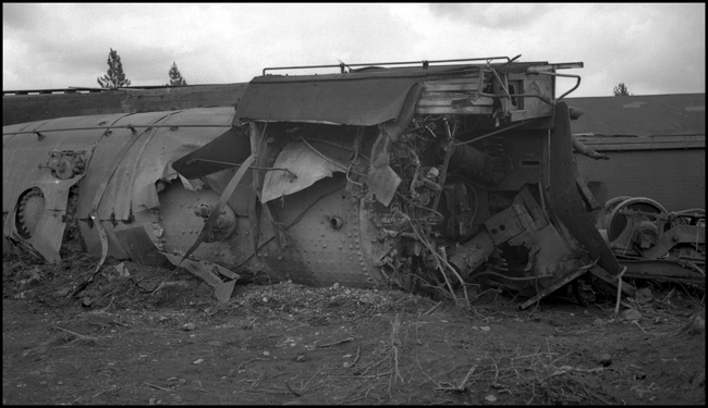 Boiler and cab of NP 2239, Class Q-5 locomotive with 3rd #2 derailed 1.5 miles east of Athol ID, probably caused by excessive speed.  Engineer and Fireman were killed. Engineer was probably lost according to McGee, who said he drove over to see this accident on a Sunday afternoon.  Accident had occurred on Friday June 13.  
