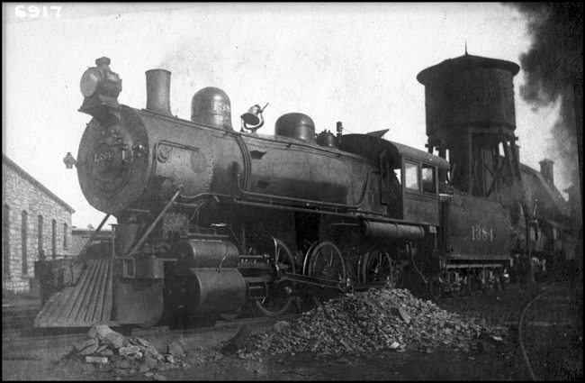 NP 1384,  10 Wheeler Vauclain locomotive, at Spokane, WA in front of water tower.