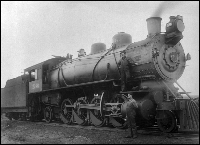 NP 1546, Class W, Mikado with crew member posing for camera in Spokane. WA.