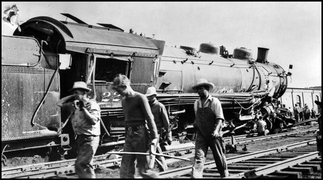 NP 2231, Class Q-5 on 1st No. 2, colliding with CB&Q 7008 at Billings.  Section workers pass in front of camera.  Engr. Graves on 2231.