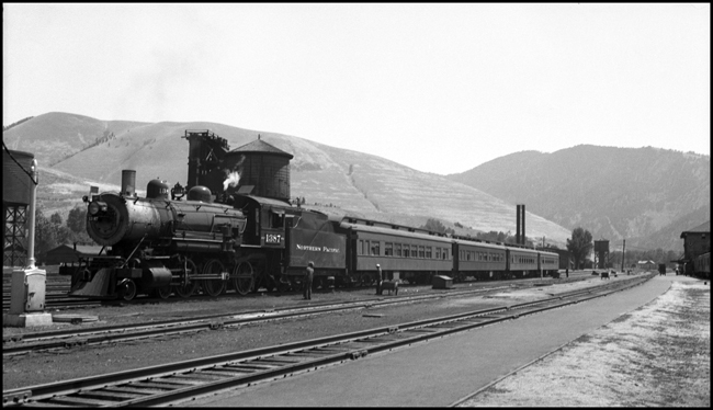 NP X1387W, a Class S-4, 10 Wheeler coupled to passenger cars in Missoula, MT.  
