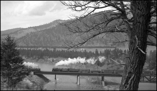 NP Train X5124E, with NP 5124, Class Z-8, meeting Train 2nd No. 2 with NP 2606, Class A on Hellgate River Bridge Bonner, MT