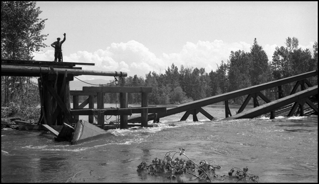 Bridge 23.2 over the Bitter Root being rebuilt.  Paul Bretelsen, lineman, waving.