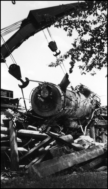 View of the front end of NP 1356, in the slings of Wreckers 41 and 44 as they bring the locomotive out of the Bitter Root River.