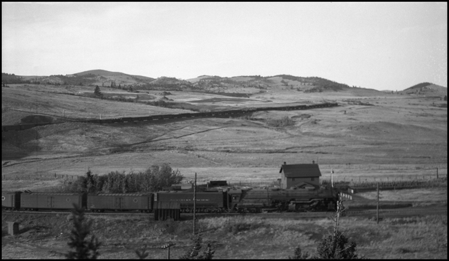 NP X5125E passes Austin section house, pulled by NP 5125, Class Z-7.