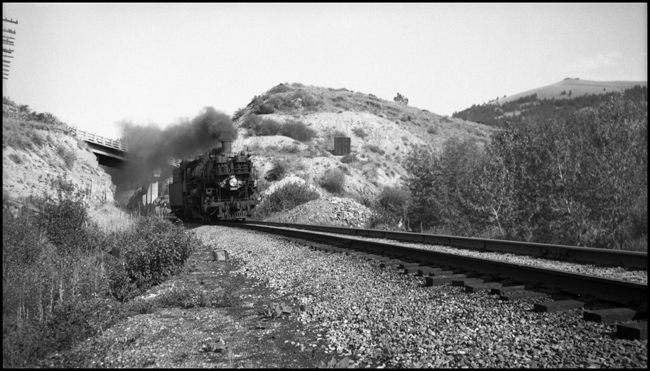 NP X 1856W with NP 1856, Class W-5 passes under a highway bridge near Blossburg