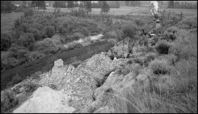 Cat moving dirt from landslide on NP 6th Subdivision 2.5 miles west of Dixon, MT