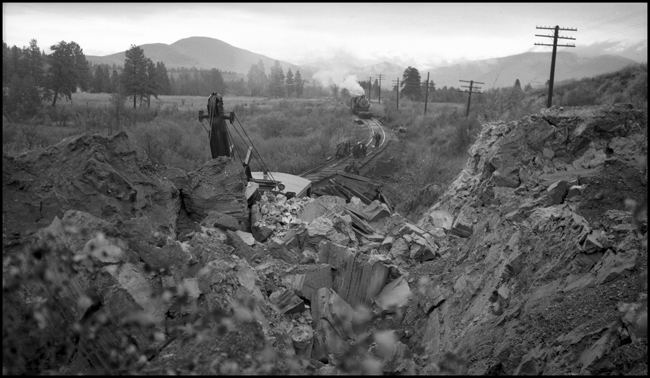 Shovel moving dirt from landslide on NP 6th Subdivision 2.5 miles west of Dixon, MT