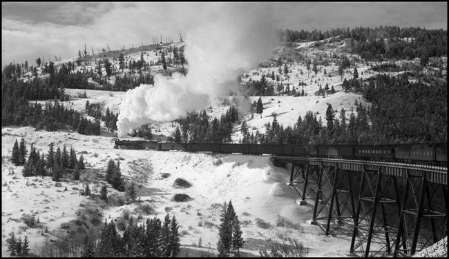 NP 2nd No. 3 with NP 2606, Class A locomotive crosses trestle near Skyline, MT.