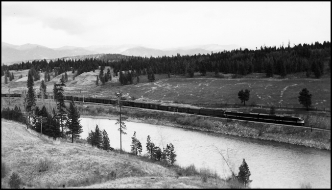 NP X6001W with Dynamometer Car NP 276 behind the power, moving between Nine Mile and Lothrop.