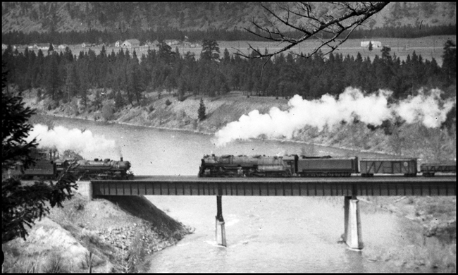 NP Train X5124E, with NP 5124, Class Z-8, meeting Train 2nd No. 2 with NP 2606, Class A on Hellgate River Bridge Bonner, MT