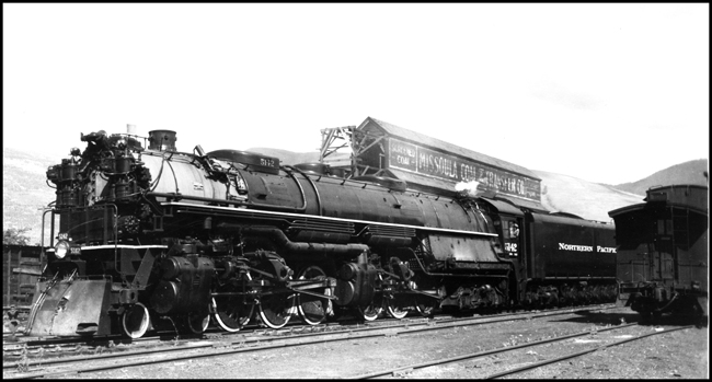 NP X5142W, with NP 5142, Class Z-8, leaving Missoula on its first trip, while passing Missoula Coal and Lumber Company. 