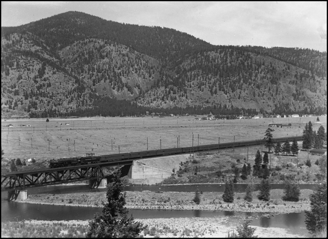 NP Train 1st No. 1 with NP 2665, Class A-3 pulling train across bridge by Bonner 