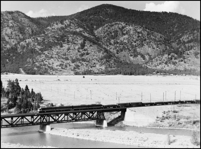 NP X6003W crossing bridge at Bonner, headed for Missoula with FT locomotive 6003.