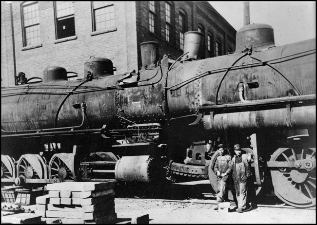 NP 1572, Class W, and another Class W locomotive involved in head-on collision and now at shops for repair.