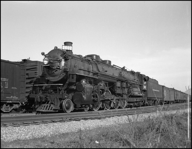 NP train 3, westbound Alaskan, with 4-8-4 no. 2607, leaves Thompson Falls, MT.