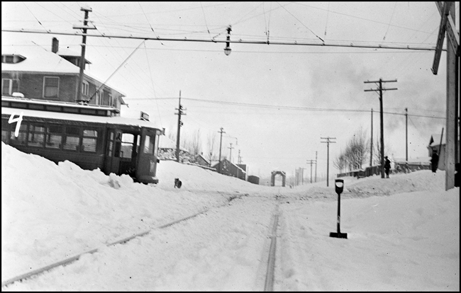 Crossing of NP track and Spruce St., Missoula, looking toward truss bridge, after train-trolley accident.