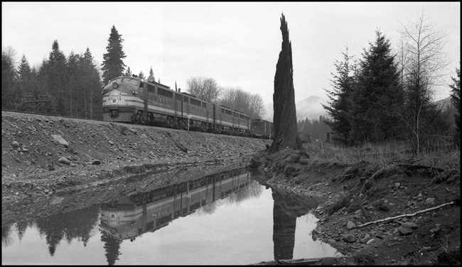 NP freight X6003E with new FT diesel 6003 passing old snag, Maywood, WA.
