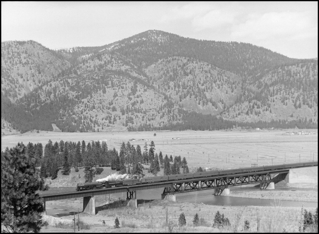 NP Class A3, 2665 hauls the first section of the NCL, Train No. 1 on the bridge over the Clark Fork River near Bonner MT.