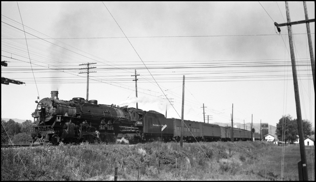 NP 2609, class A with train No. 4 detouring on the Milwaukee at Drummond, Montana on July 2, 1945 due to a wreck of NP 5102 at Gold Creek.