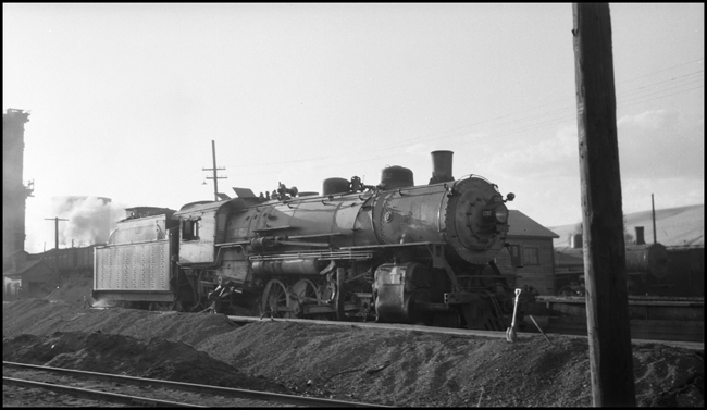 NP 1792, Class W-3 getting ashes dumped at the cinder pit at Missoula roundhouse.
