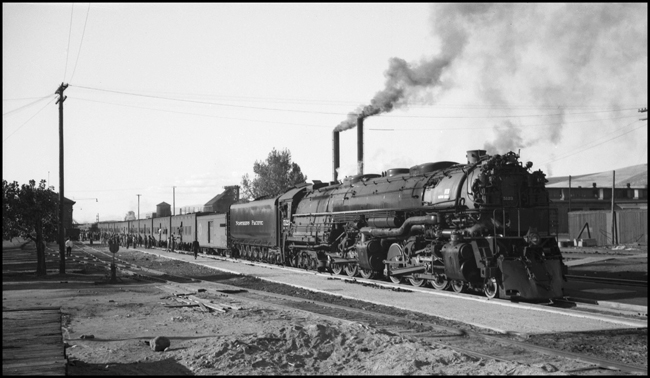 An NP troop train, powered by Class Z-7 4-6-6-4 no. 5123, is operating as Third No. 2 at Missoula, Montana. Engineer R. B. Christy is handling this train.