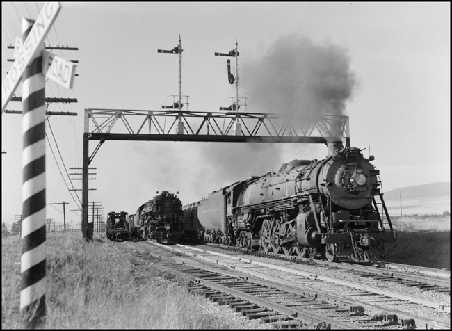 NP First No. 2, Class A-3 4-8-4 no. 2665, Engineer L. H. Taylor, receives a 