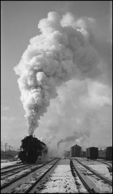Passenger Extra 5120 East leaving Missoula, Montana. The wrecker shed appears in the distance, right of center.