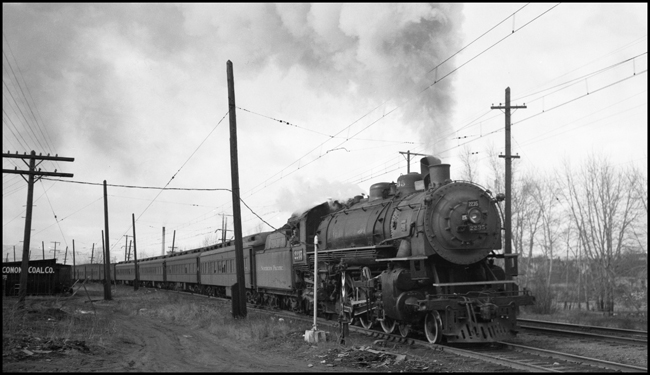 NP Passenger Extra 2235 East on Miwaulkee Road track leaves Missoula. The reason for the detour is the derailment on the NP, east of Missoula, of wrecker no. 47. (See RVN 09581-09595). Engineer Marcellus 