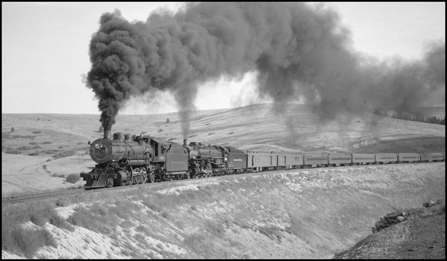 Train No. 1 pulled by NP 1539, Class W, with Engr. Dickman and NP 2607, Class A, with Engr. Jeffery on O'Keefe fill between DeSmet and Evaro