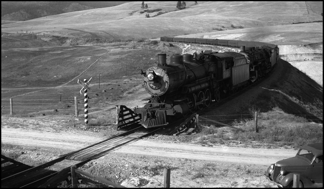 NP Train No. 2 with NP 2610, Class A, Engr. Jeffery and NP 1539, Class W-3, Engr. Dickman between Nagos and DeSmet, MT.  13 cars on No. 2.