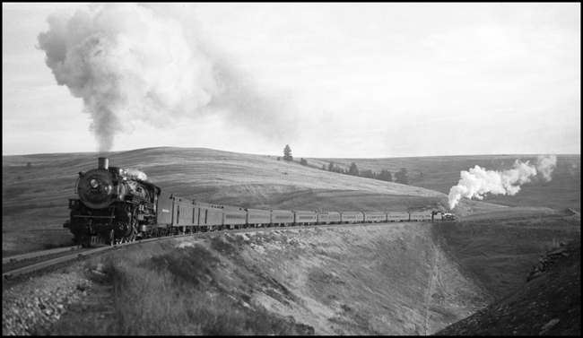 NP Train No.1 with NP 2611, Class A on the head end and NP 1815, Class W-3 helping backward at the rear.