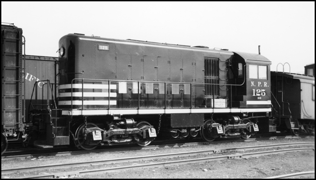 NP 125 Class DE switcher locomotive built by Alco, on its way from the factory to Seattle as it passes through Missoula