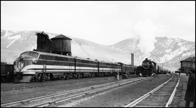 NP Train No. 603 powered by Electro Motive 103, experimental diesel electric locomotive, sitting in Missoula on test run from Northtown to Auburn. NP Dynamometer Car behind 603's locomotive on the left and NP passenger train No. 1 pulled by NP 2652, Class A-4 on the right.