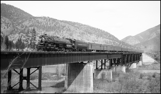 NP train No. 1 with NP 2650, Class A-2, crossing Missoula River near Bonner, MT.