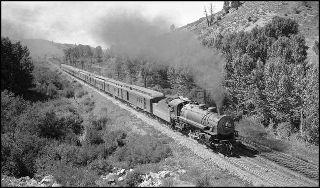NP Train No. 4 pulled by NP 2235, Q-5 locomotive east of Bozeman near Mount Ellis crossing.  Helper at rear of train is NP 1522, Class W locomotive.