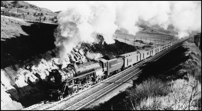 NP Train No. 1 pulled by NP 2652, Class A-3 and pushed by NP 2240, Class Q-5, as it climbs Bozeman Hill near Muir.1