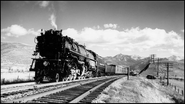 NP Train X5107W with NP 5107, Class Z-6 climbing the grade at Hoppers, MT.