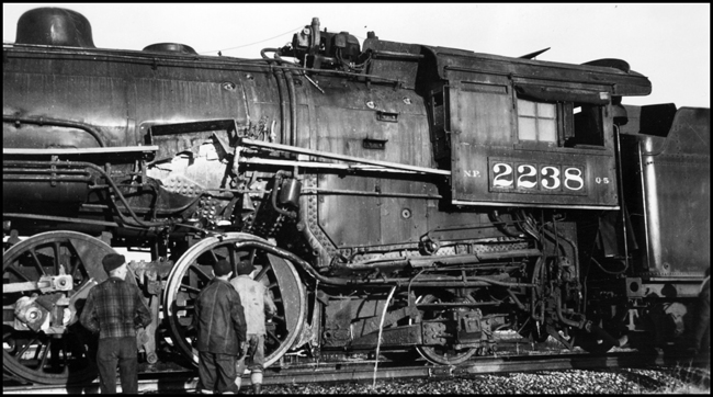 NP 2238, Class Q-5 locomotive with puncture in boiler and firebox caused by broken side rod.  Engr J Jondrow and Fmn Baxter were fatally injured after being sprayed with live steam and fire and then jumping from the moving engine.  Train ran one mile after side rod broke.
