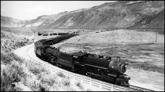 NP Train No. 217, double headed by NP 1529, Class W and NP 2152, Class Q-3 pulling passenger train around Gardiner loop .