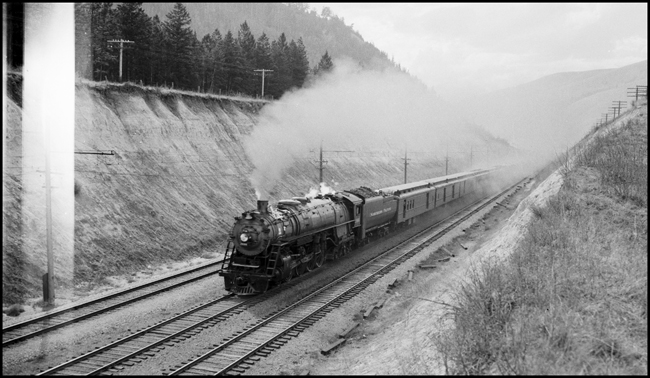 NP Train No. 2 with NP 2666, Class A-3, between Bonner and Missoula, paralleling MILW electric line.