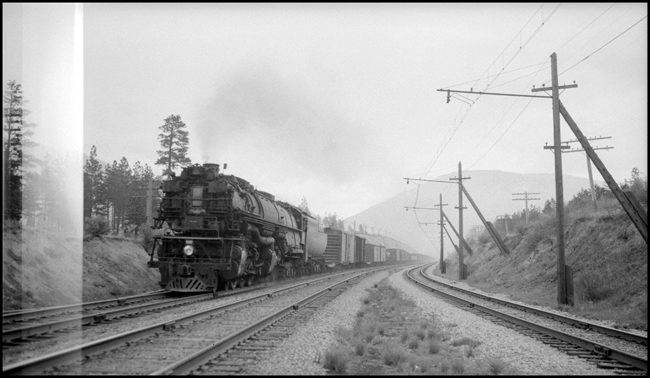 NP Train X5107W with NP 5107, Class Z-6 pulling freight between Bonner and Missoula, while paralleling the CMSP&P line.