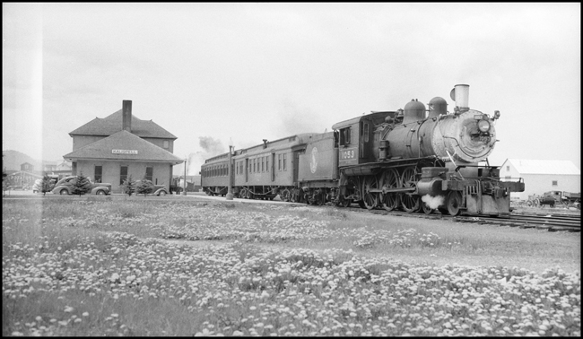 GN Train No. 244 pulled by GN 1053, 4-6-0 locomotive with passenger run at Kalispell, MT