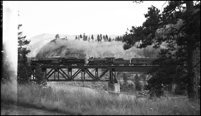 NP Train No. 2 pulled by NP 2665, Class A-3 and NP 2256, Class Q-6 crossing bridge west of Bonner