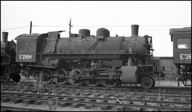 USSR 2994, 2-10-0 steam locomotive in Portland, OR boarded up for possible shipping to USSR, w/o tender.