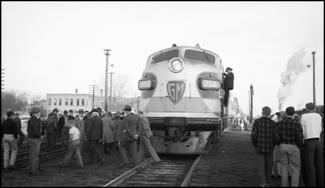 GM 754 test train on No. 3/1 at Staples, MN with crowd of on-lookers.