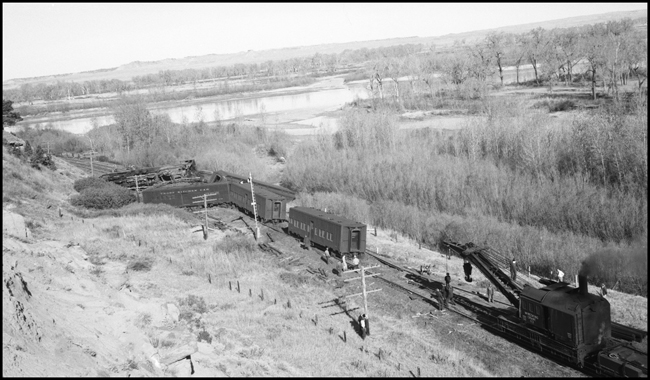 Wrecker beginning to start work of rerailing derailed passenger extra W at Flynn, MT